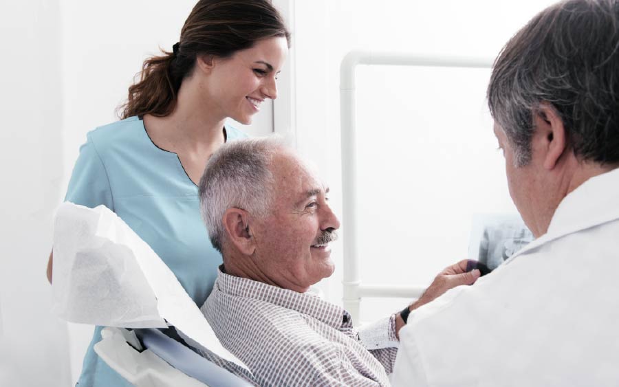 Dentist reviewing medical information with patient